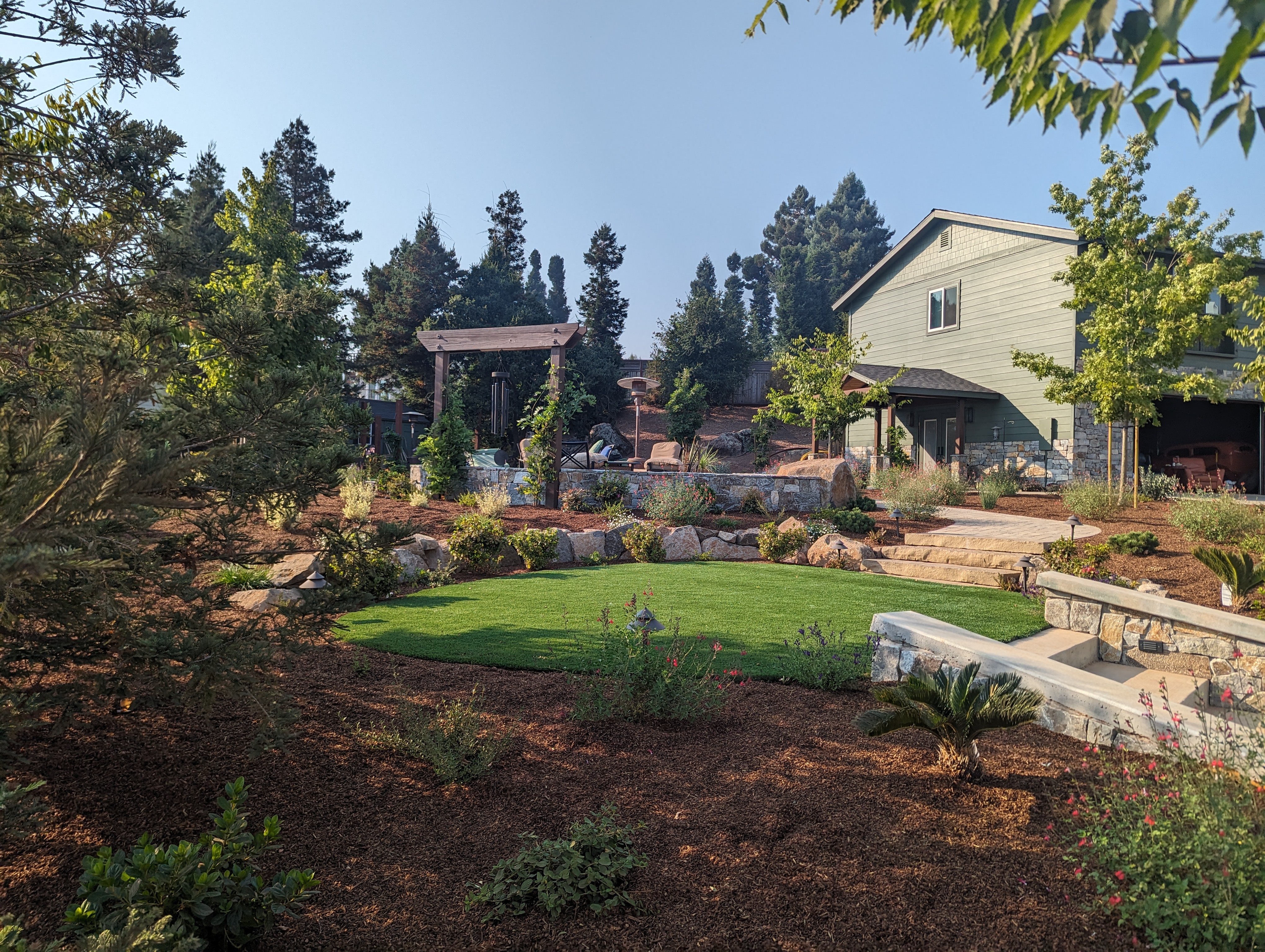 North Bay backyard with stone walls and landscaping built by QBR