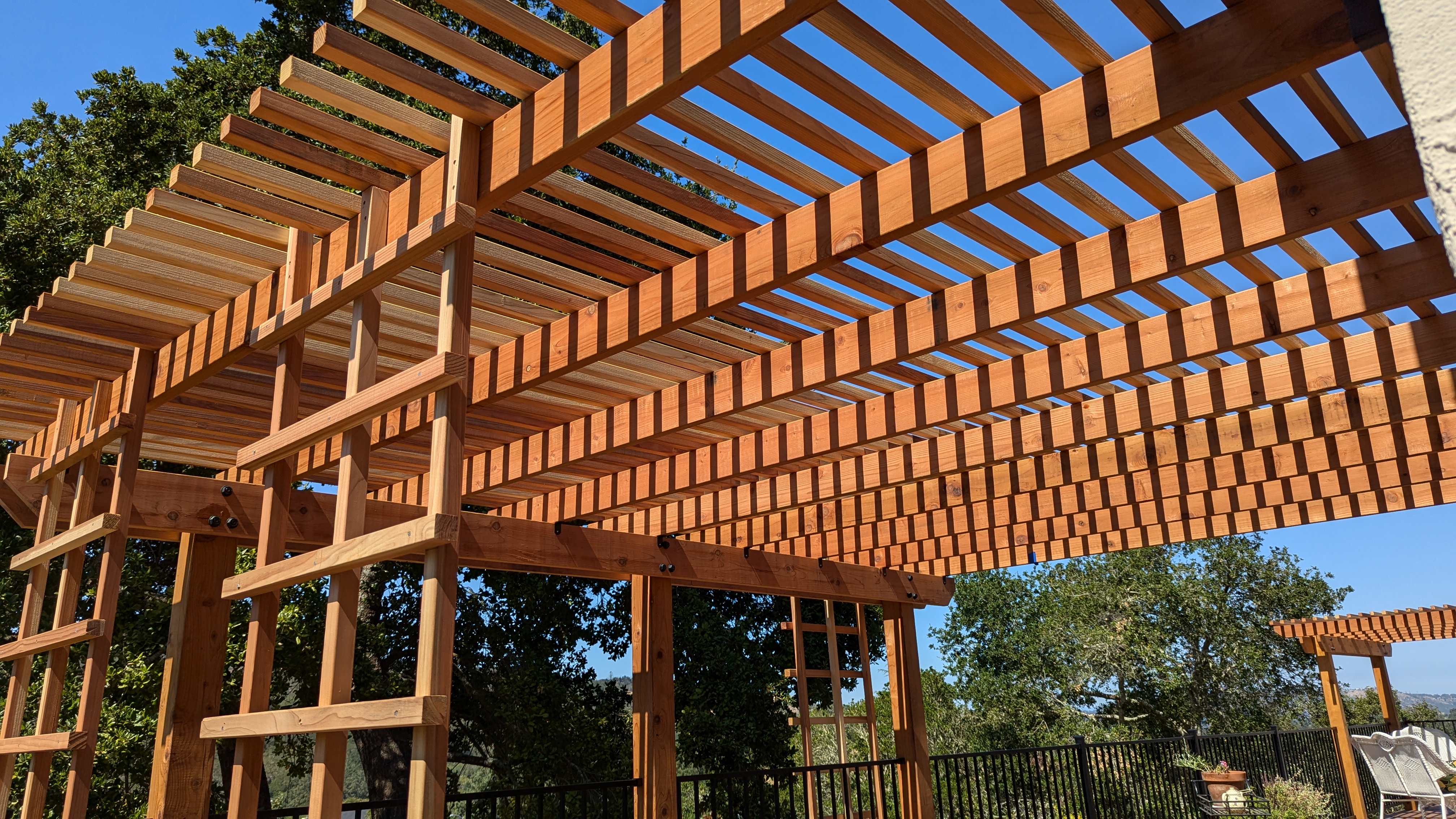Custom redwood structure with vertical framing built by QBR